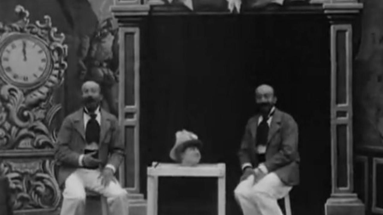 The Triple Conjurer and the Living Head